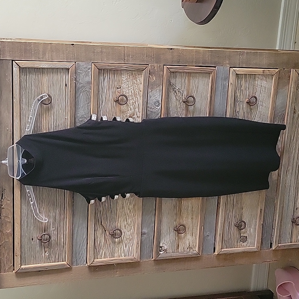 Xtraordinary black dress size 1. Rhinstone side cutouts. Halter style